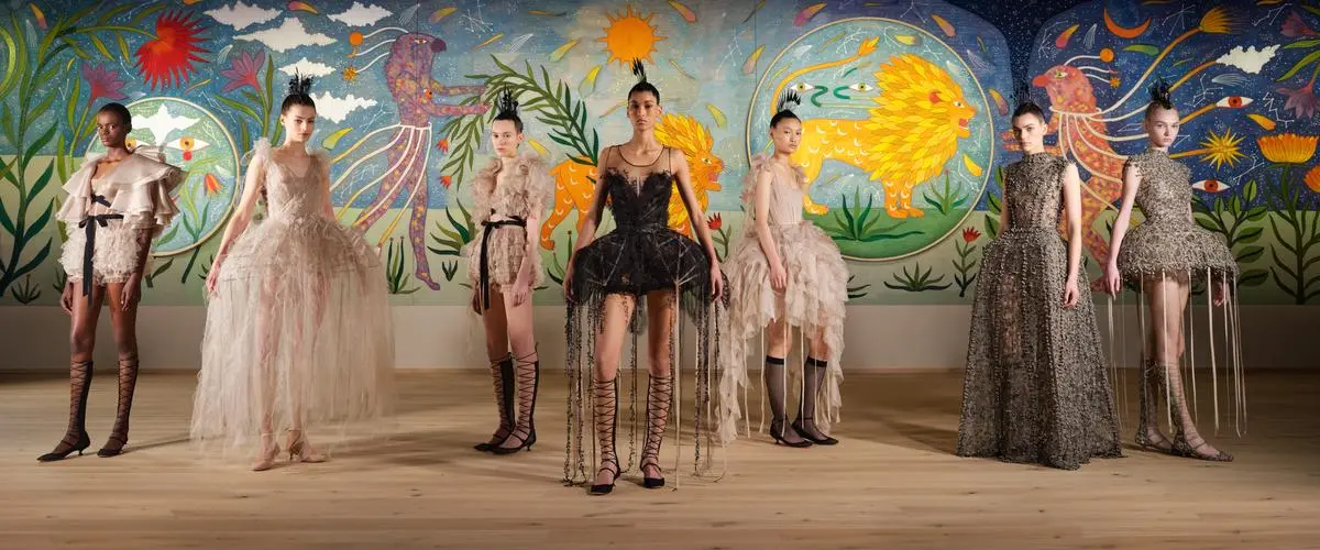 Models stand in front of the “The Flowers We Grew” installation at “Dior haute couture SS25”. Models stand in front of the “The Flowers We Grew” installation at “Dior haute couture SS25”.