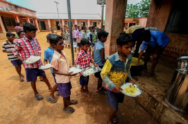 Primary school students collect midday meals inside the Similipal Tiger Biosphere Reserve in Odisha; a 2018 photograph.
NFHS-5 shows stunting, undernourishment and anaemia continue to affect a large percentage of Indian children. Primary school students collect midday meals inside the Similipal Tiger Biosphere Reserve in Odisha; a 2018 photograph.
NFHS-5 shows stunting, undernourishment and anaemia continue to affect a large percentage of Indian children.