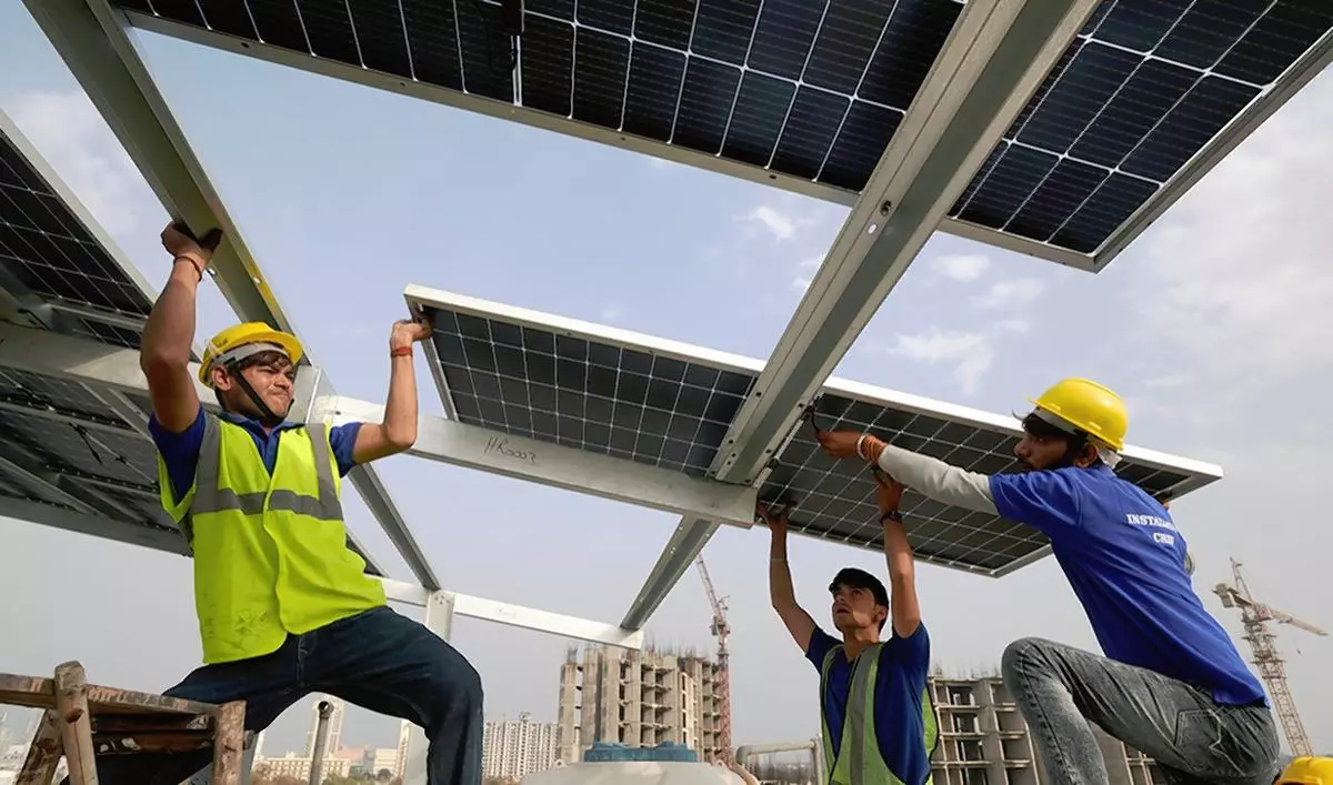 Solar panels being insatalled on the rooftop of a house in Gurugram