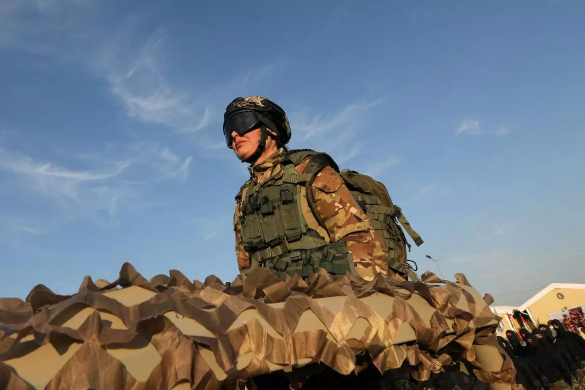 An Iraqi-Kurdish Peshmerga soldier takes part in a graduation ceremony in Arbil, the capital of Iraq’s northern autonomous Kurdish region, on December 3, 2024.