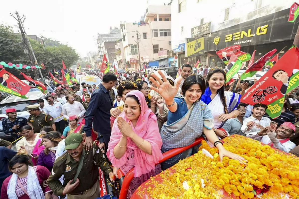 Samajwadi Party MP Dimple Yadav with party candidate Naseem Solanki during a roadshow in Sisamau on November 18. The seat fell vacant after the candidate’s husband, Irfan Solanki, was convicted in a criminal case earlier this year. 