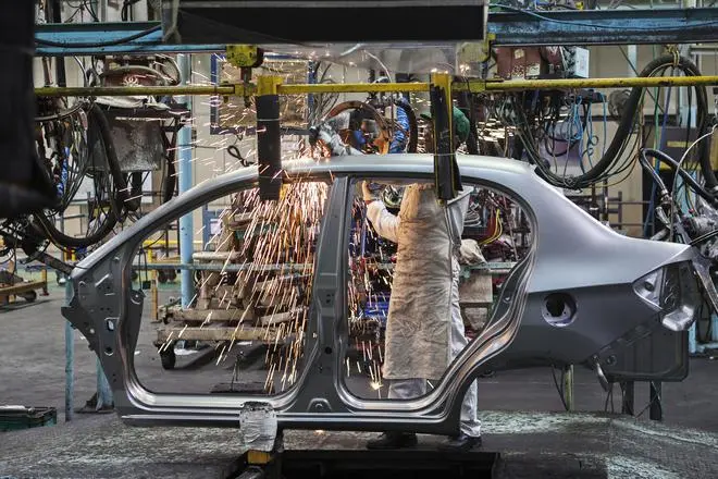 At a car factory in Greater Noida, UP, an employee works on the body of a vehicle. There is a gross under-reporting of accidents in the industry. At a car factory in Greater Noida, UP, an employee works on the body of a vehicle. There is a gross under-reporting of accidents in the industry.