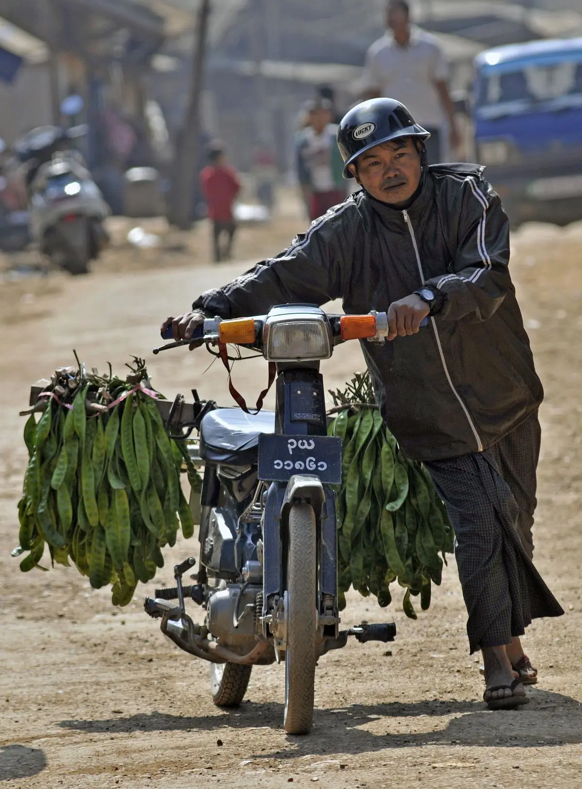A person from Myanmar brings beans for sale from Tamu across the border to Moreh in Manipur. A 2012 photograph. 