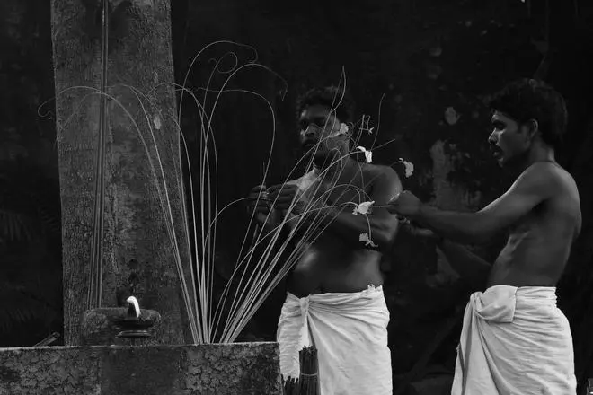 During a Mavilan Theyyam, a person belonging to same community acts as a parikarmi (priest). During a Mavilan Theyyam, a person belonging to same community acts as a parikarmi (priest).