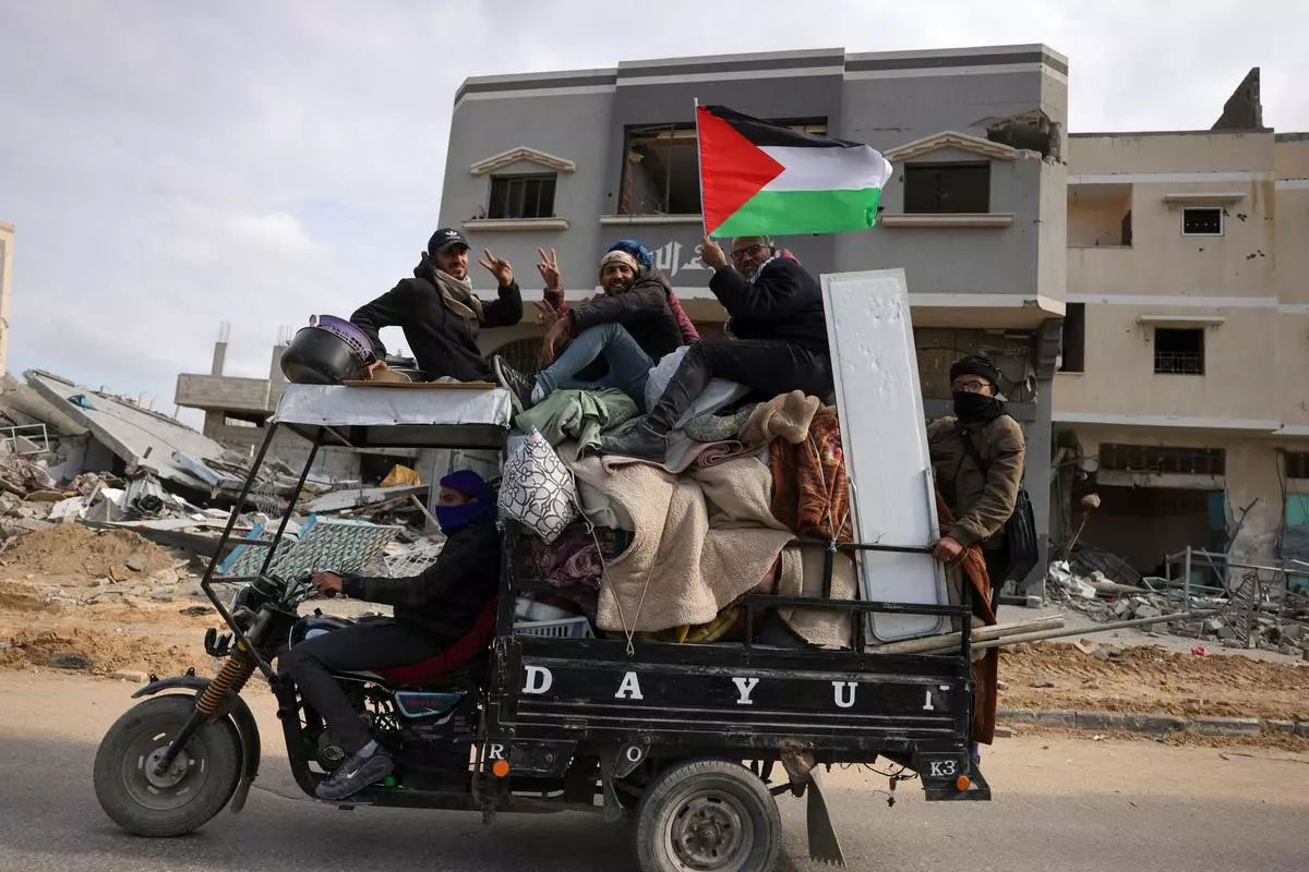 Palestinians transport belongings in Gaza’s southern city of Rafah on January 22, 2025, as residents return following the ceasefire deal. 