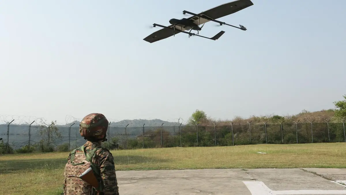 A soldier looks at a drone at the Akhnoor sector near the Line of Control (LoC) in the Jammu region on May 19. A soldier looks at a drone at the Akhnoor sector near the Line of Control (LoC) in the Jammu region on May 19.
