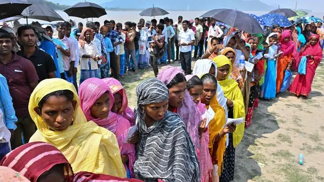 Outside a polling booth in Assam’s Darrang district on April 26, 2024, in the second phase of the Lok Sabha election. Opposition leaders and critics have now alleged that massive vote fraud was committed in the election.