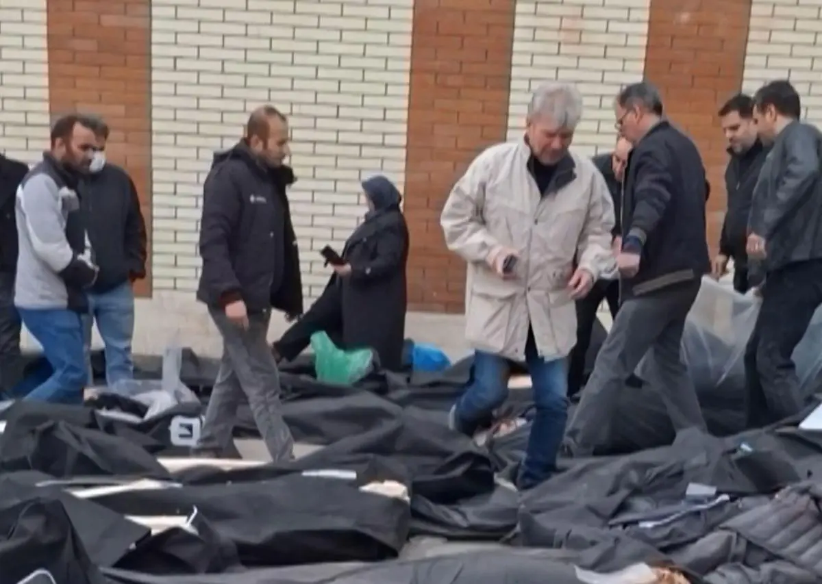 A screengrab from a video posted on social media on January 13, 2026, showing dozens of bodies on the ground as grieving people search for their loved ones, at the Forensic Diagnostic and Laboratory Centre of Tehran Province in Kahrizak.