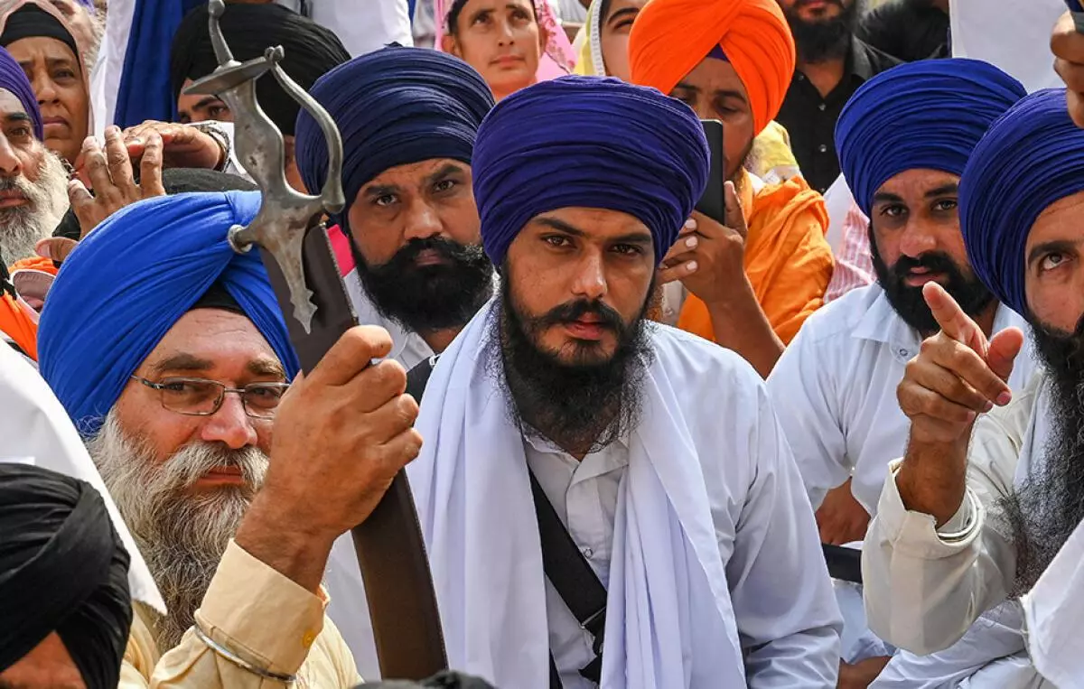 Amritpal Singh, along with devotees, takes part in a Sikh initiation rite ceremony at Akal Takht Sahib in the Golden Temple on October 30, 2022. A firebrand Sikh separatist, he won the parliamentary election by a margin of nearly 2,00,000 votes while contesting from prison.