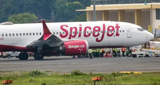 The Delhi-bound SpiceJet airplane at Jay Prakash Narayan Airport in Patna after it made an emergency landing. The Delhi-bound SpiceJet airplane at Jay Prakash Narayan Airport in Patna after it made an emergency landing.