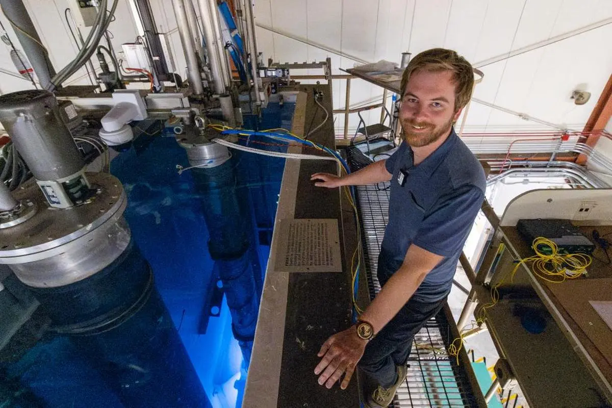 Kyle Reed, of Oak Ridge National Laboratory, at The Ohio State University Nuclear Reactor laboratory, where researchers recently demonstrated that a transistor made with GaN successfully maintained operations near the reactor’s core.