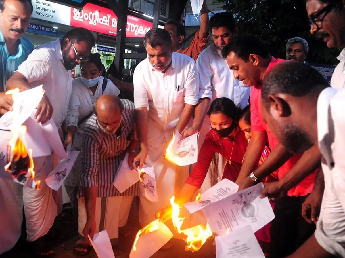 Activists staging a protest against Silver Line by burning a copy of the Detailed Project Report of the rail project, in Kozhikode in July 2022.