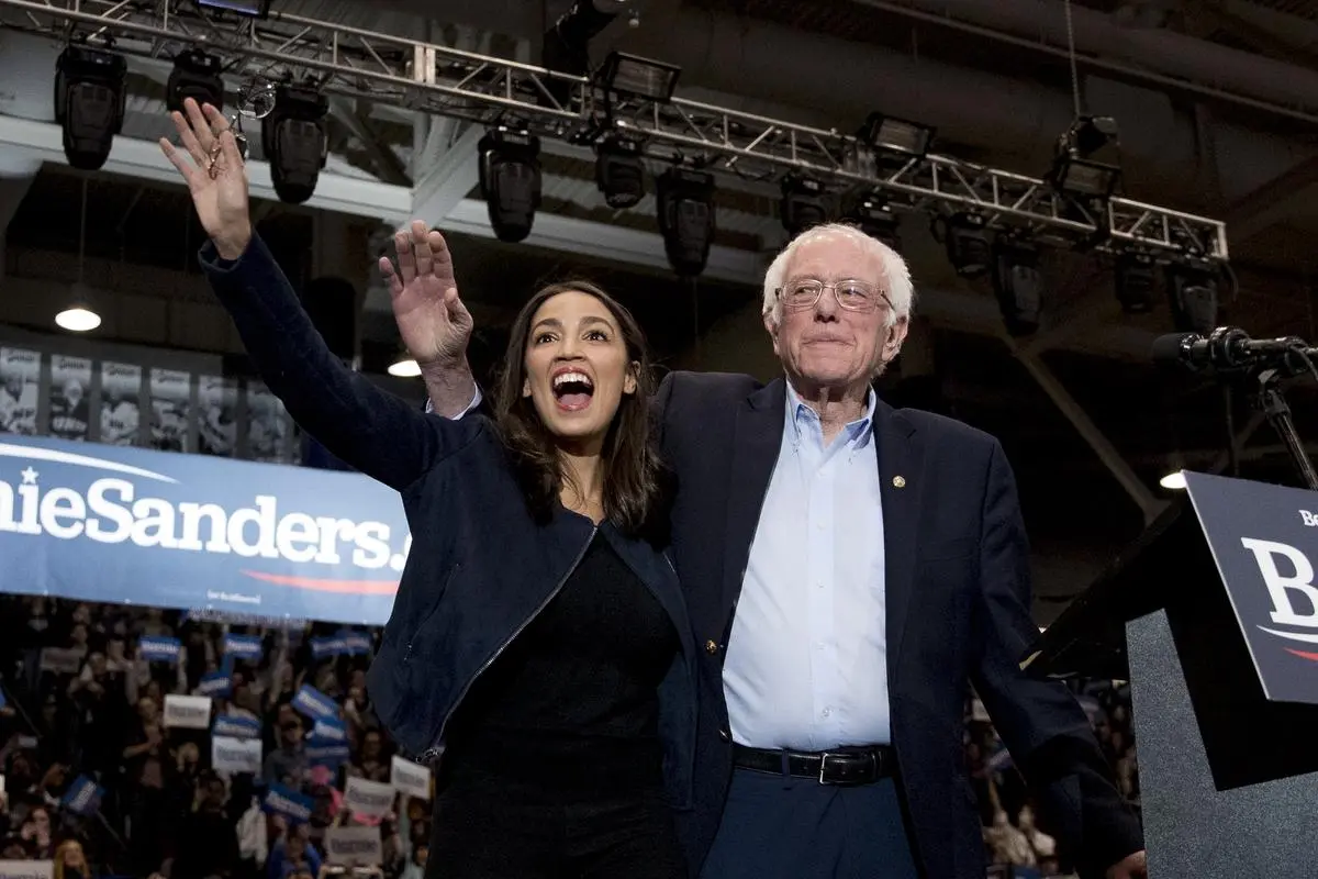 Senator Bernie Sanders (right) with Representative Alexandria Ocasio-Cortez at the Whittemore Center Arena at the University of New Hampshire in February 2020. Mamdani secured endorsements from both Ocasio-Cortez and Sanders. Senator Bernie Sanders (right) with Representative Alexandria Ocasio-Cortez at the Whittemore Center Arena at the University of New Hampshire in February 2020. Mamdani secured endorsements from both Ocasio-Cortez and Sanders.