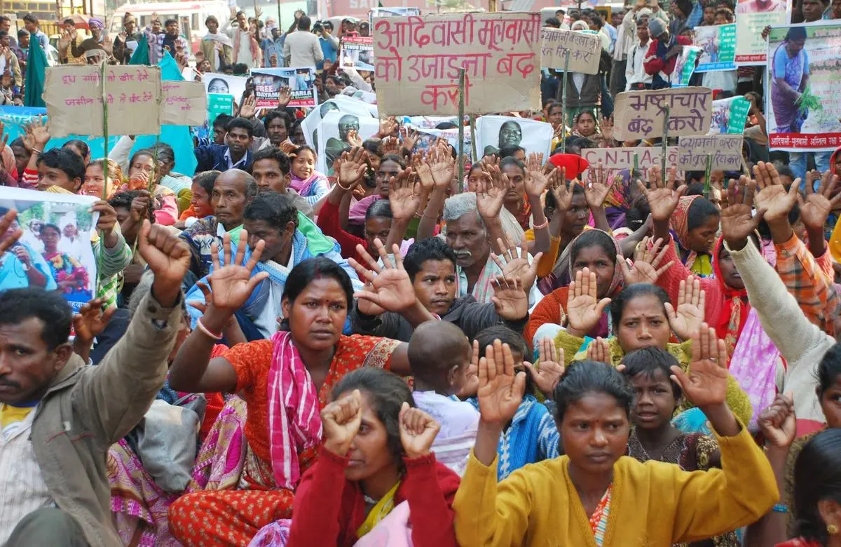 Tribal people protest against the arrest of social activist Dayamani Barla and the Nagri land acquisition in Ranchi on December 15, 2012. 