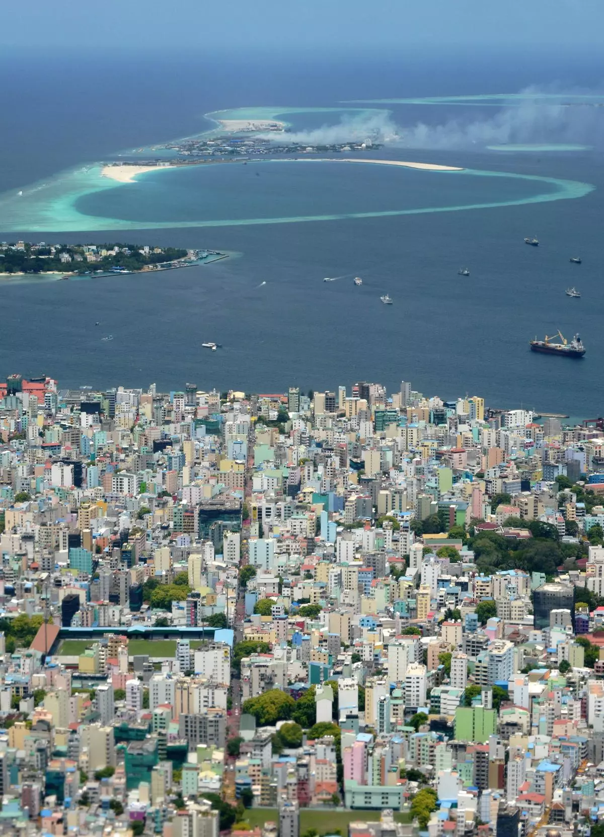 An aerial view of the island of Male and nearby Thilafushi Island (top). There was an unwritten understanding that the Male-Thilafushi project would be awarded to China after Yameen came back to power.