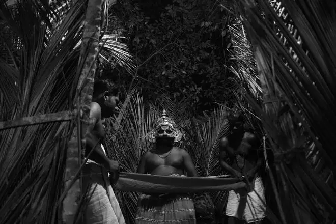 Kalichan Theyyam at a sacred grove in northern Kerala. Kalichan Theyyam at a sacred grove in northern Kerala.