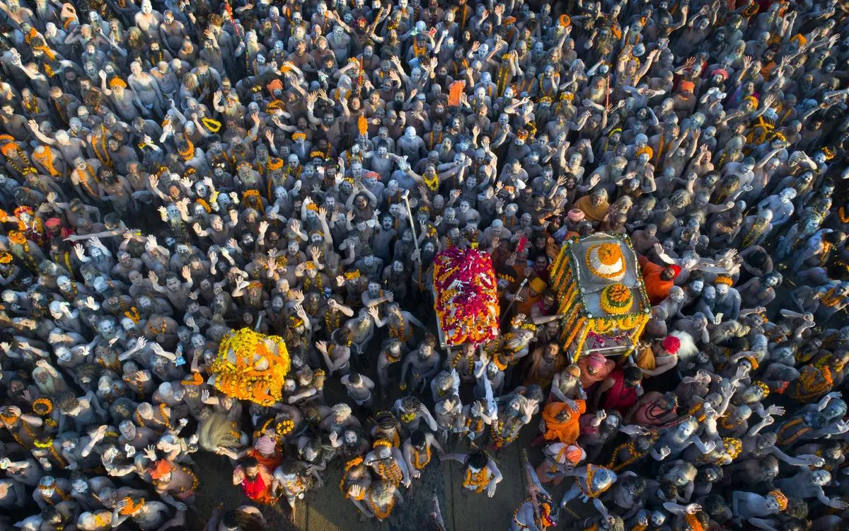 In this 2019 photo, Naga Sadhus arrive in a procession for a dip at Sangam, the confluence of three holy rivers, during the Kumbh Mela in Prayagraj. Cannabis is an integral part of the Kumbh Mela.