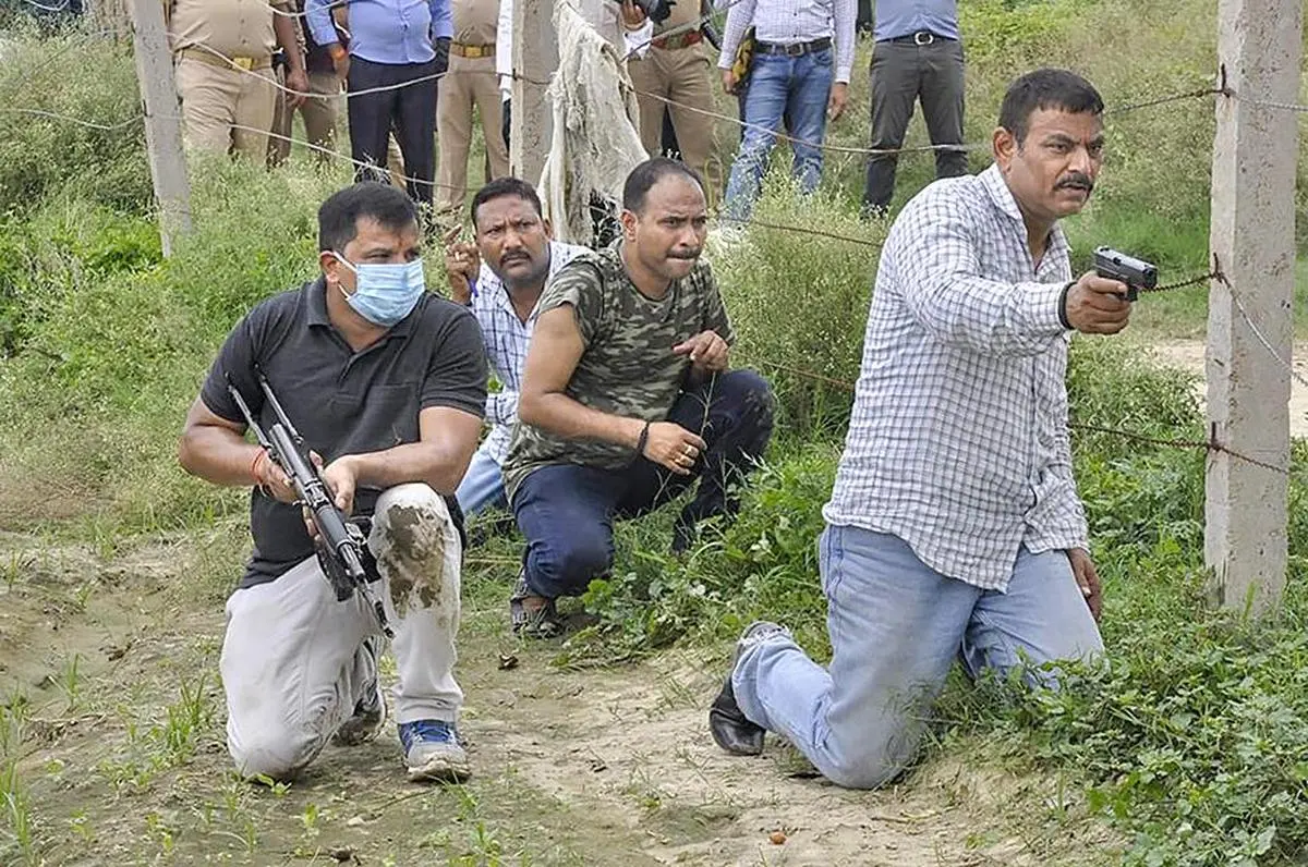 Special Task Force and Forensic teams re-enact the events leading to the encounter of gangster Vikas Dubey, as part of an ongoing investigation of the case, in Kanpur district, on July 18, 2020.  Special Task Force and Forensic teams re-enact the events leading to the encounter of gangster Vikas Dubey, as part of an ongoing investigation of the case, in Kanpur district, on July 18, 2020.