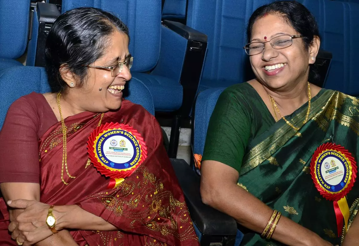 Rohini Godbole (left)  with Vaidehi Ganeshan of IGCAR, Kalpakkam, as she receives the C.V. Raman Vijnana Puraskara at the 4th National Women’s Science Congress in Bangalore, on November 7, 2011.   