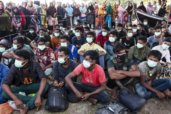 Rohingya refugees at a temporary shelter in North Aceh, Indonesia, on November 16. Rohingya refugees at a temporary shelter in North Aceh, Indonesia, on November 16.