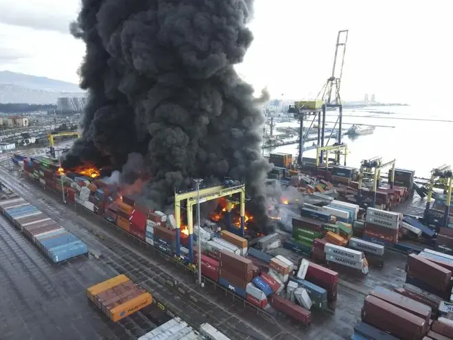 Smoke rises from burning containers at the port in the town of Iskenderun, southern Türkiye, on February 7, 2023. Smoke rises from burning containers at the port in the town of Iskenderun, southern Türkiye, on February 7, 2023.
