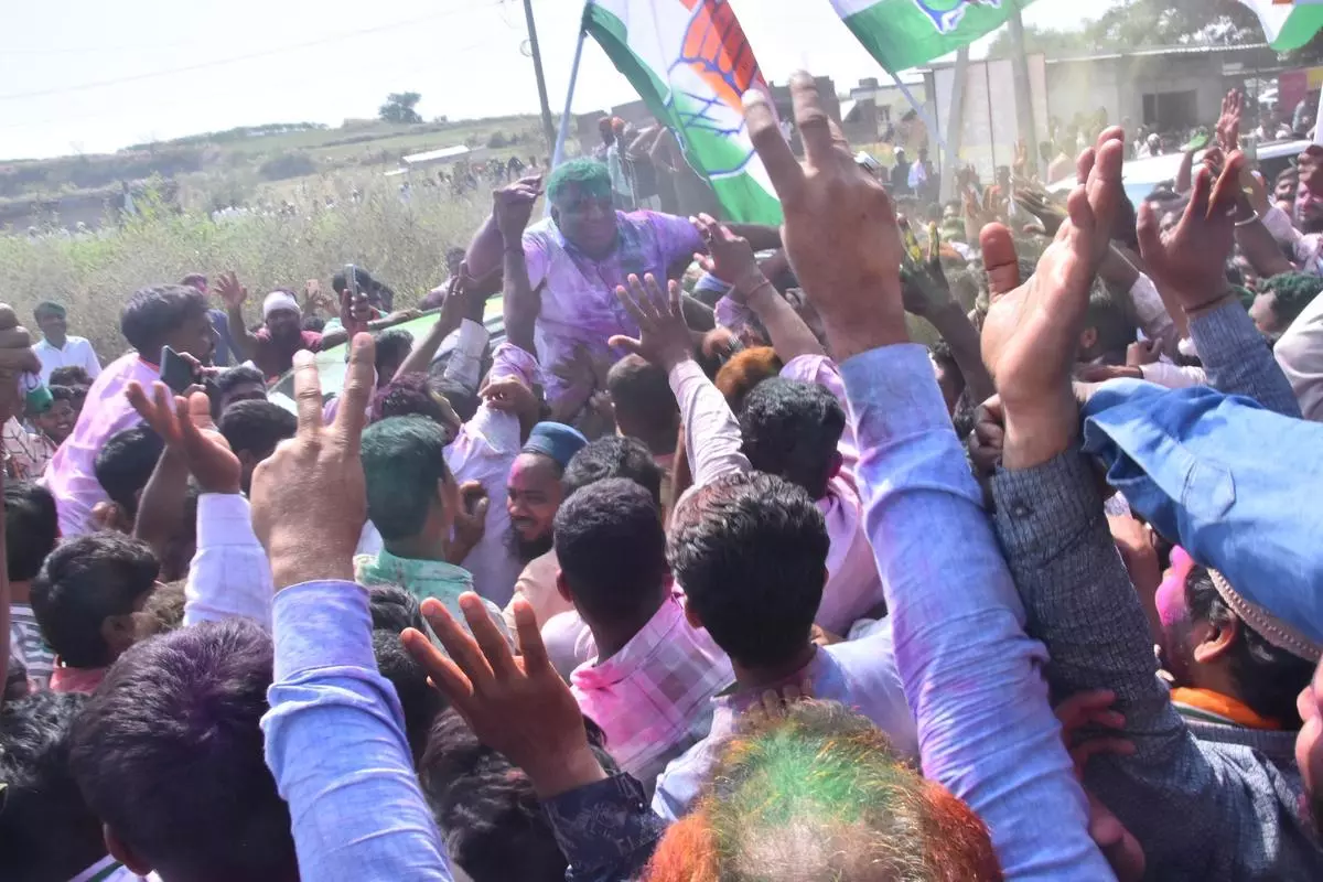 Congress candidate Yasir Ahmed Khan Pathan being lifted by party workers after the announcement of his victory in the Shiggaon Assembly byelection in Haveri on November 23.