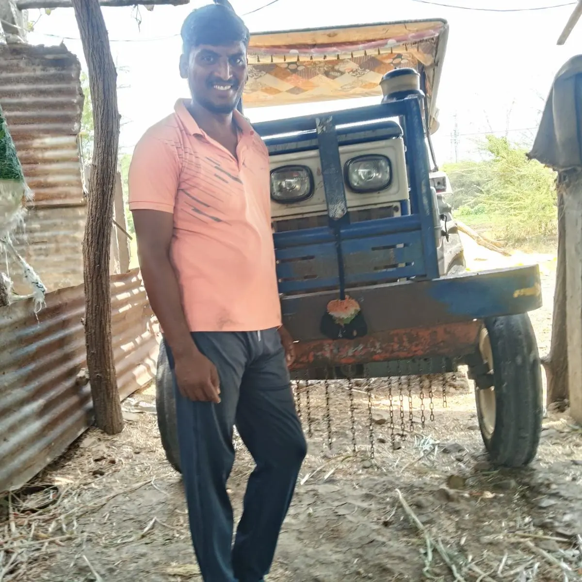 Pradeep Ingale, standing near his tractor at his farm, failed to get diesel for three days. He finally received 10 liters on May 27. 