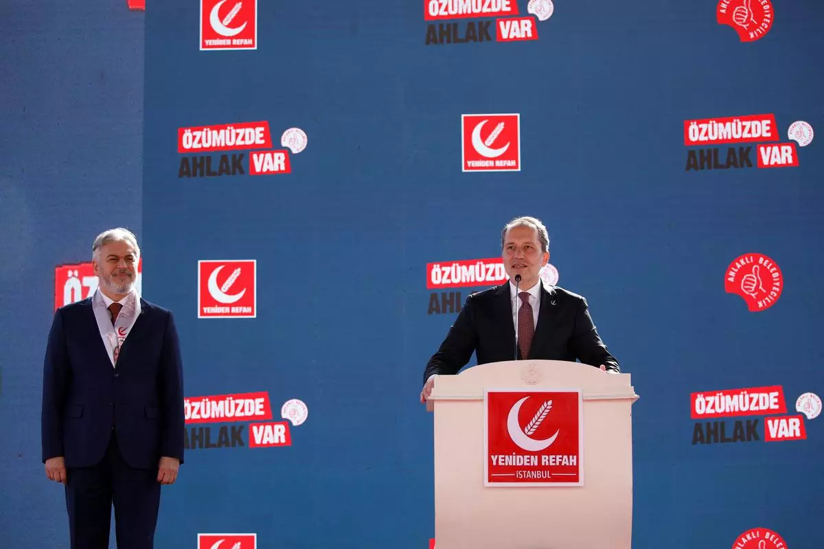 Ali Fatih Erbakan, head of the New Welfare Party, speaks at a rally in Istanbul ahead of local elections in Turkiye. Mehmet Altinos, the party's Istanbul mayoral candidate, can also be seen.