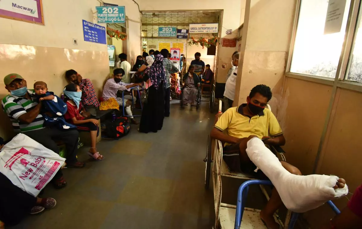 Patients wait in long queues to consult doctors at Osmania General Hospital.