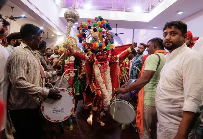 The Bajrangi Sena on the move in full regalia and to the accompaniment of percussion beats just before entering the main temple and the sanctum. The Bajrangi Sena on the move in full regalia and to the accompaniment of percussion beats just before entering the main temple and the sanctum.