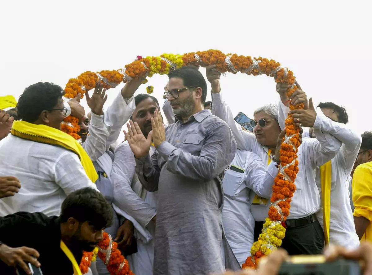 Jan Suraaj founder Prashant Kishor being garlanded by supporters during the formal launch of his new political party at Veterinary College grounds, in Patna, on October 2, 2024. 