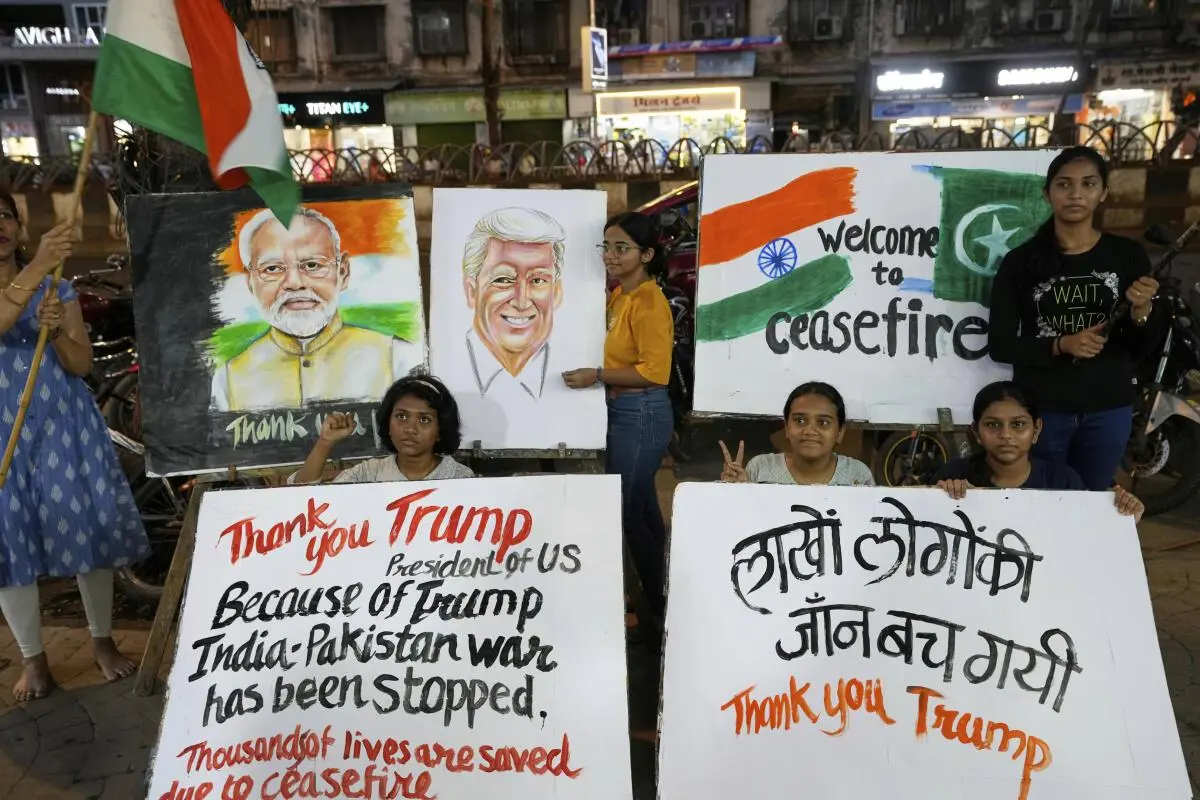 Students of an art school and their teacher carry hand-drawn portraits of Indian Prime Minister Narendra Modi and US President Donald Trump as they celebrate the ceasefire between India and Pakistan, in Mumbai on May 10, 2025. Students of an art school and their teacher carry hand-drawn portraits of Indian Prime Minister Narendra Modi and US President Donald Trump as they celebrate the ceasefire between India and Pakistan, in Mumbai on May 10, 2025.