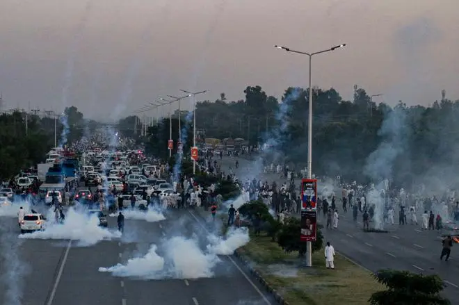 Tear gas being used to disperse supporters of the Pakistan Tehreek-e-Insaf (PTI) in Islamabad on October 21 after the Pakistan Election Commission disqualified former Prime Minister Imran Khan on charges of unlawfully selling state gifts. Tear gas being used to disperse supporters of the Pakistan Tehreek-e-Insaf (PTI) in Islamabad on October 21 after the Pakistan Election Commission disqualified former Prime Minister Imran Khan on charges of unlawfully selling state gifts.