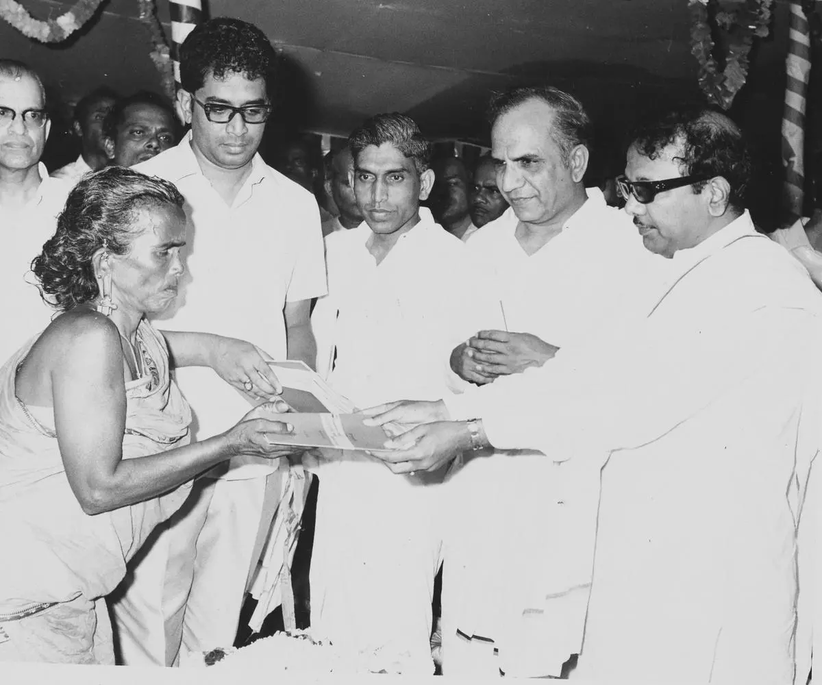 Karunanidhi handing over the patta book to a woman farmer at a function in Paramakudi on October 9, 1972. 