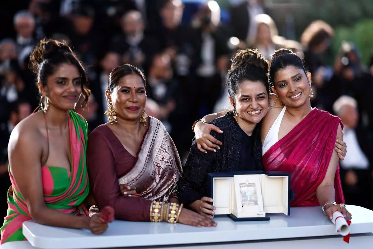 Actors Kani Kusruti, Chhaya Kadam and Divya Prabha with director Payal Kapadia after Kapadia won the Grand Prix for their film All We Imagine as Light at the 77th edition of the Cannes Film Festival.