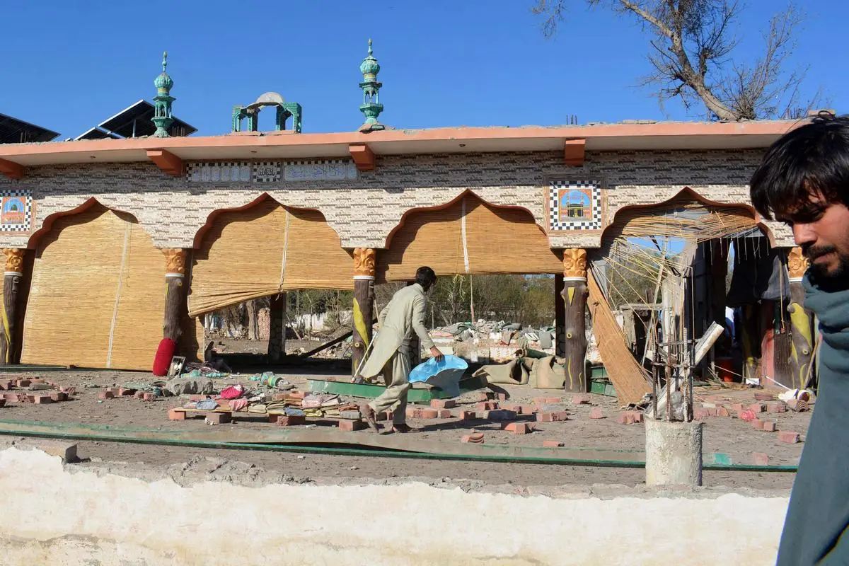 At the wreckage of a mosque on March 5, after militants detonated explosive-laden vans at an army compound in Bannu in northwestern Pakistan. The attack was claimed by the Hafiz Gul Bahadur armed group, which actively supported the Afghan Taliban in its war against the NATO coalition since 2001.