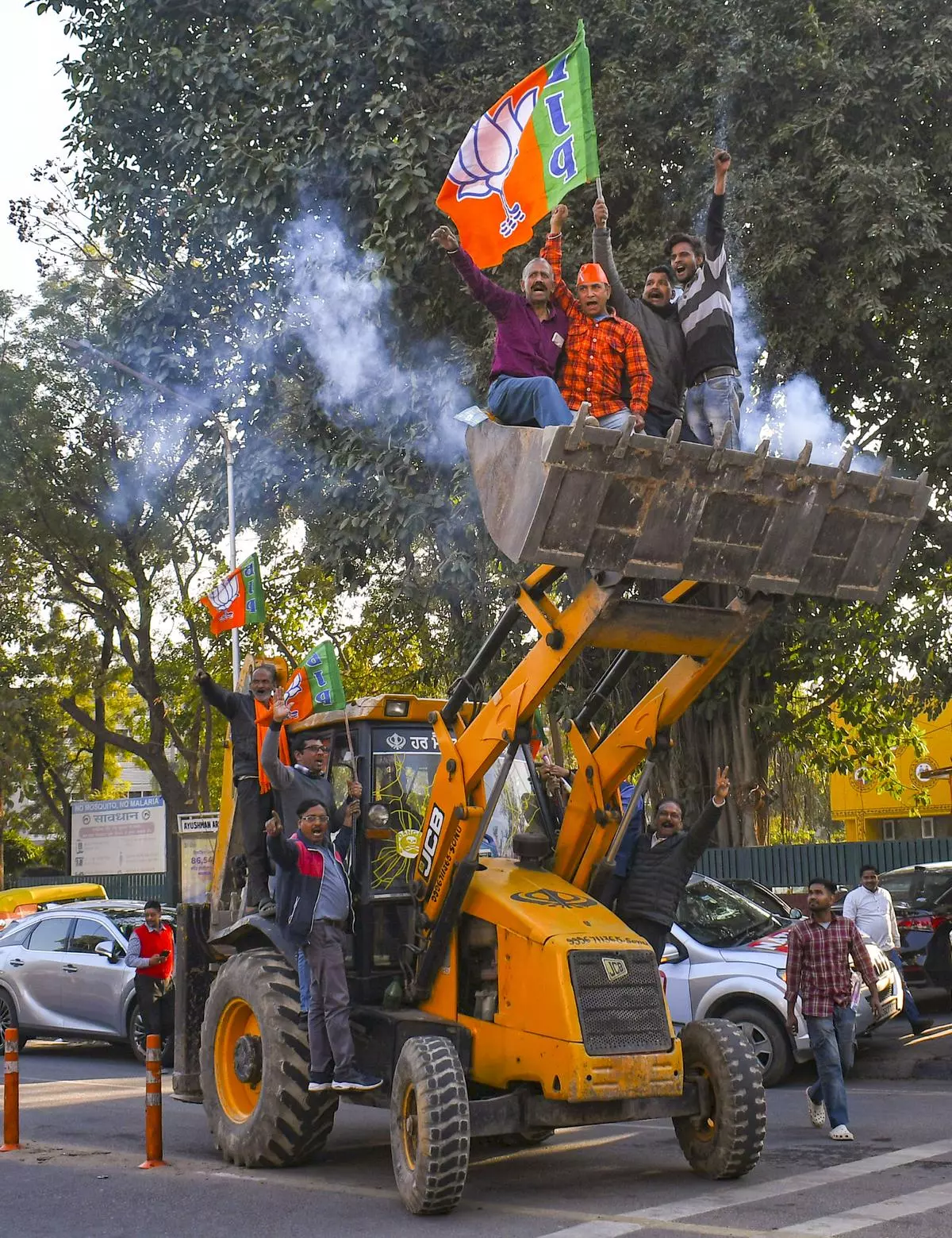 BJP workers in Punjab celebrate their party’s win in the Delhi Assembly election, in Chandigarh on February 8.