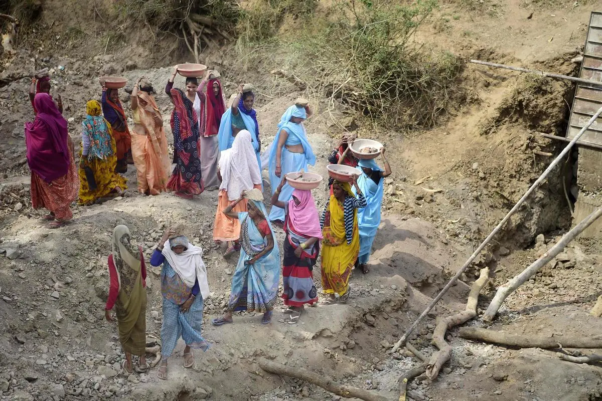 Jal Saheli (friends of water) volunteers constructing a check dam in Agrotha village, Tikamgarh, Madhya Pradesh, on June 9, 2022.