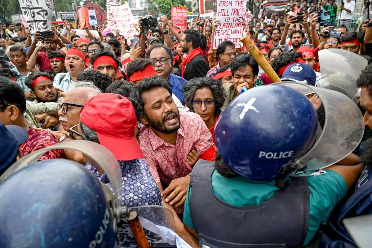 Cultural activists clash with the police during a song march on July 30 for people who were killed in the recent protests in Dhaka. The government had called for a day of mourning on that day, but students denounced the gesture as disrespectful.  