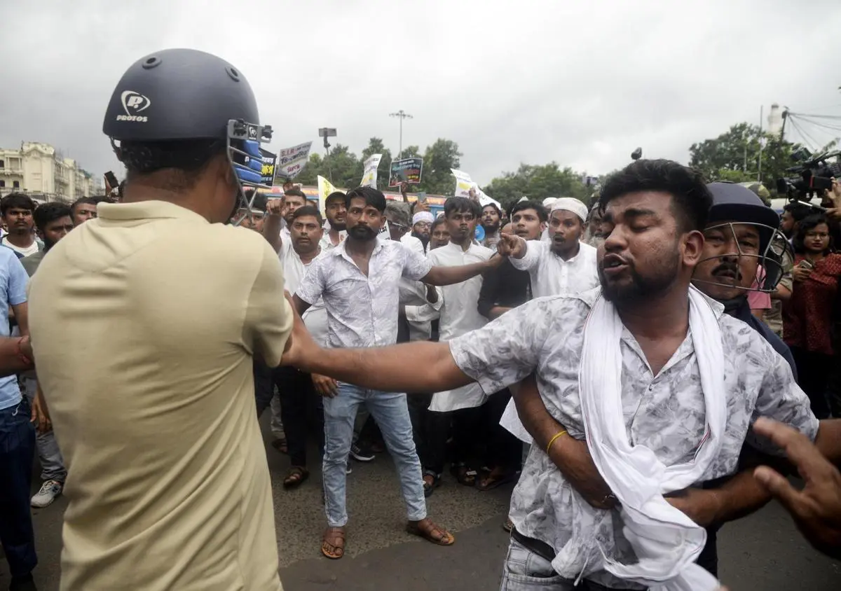Police detain protesters during a rally organised by Muslim organisations to protest against the Special Intensive Revision of electoral rolls and harassment of Bengali migrant labourers in other States, in Kolkata in August 2025.