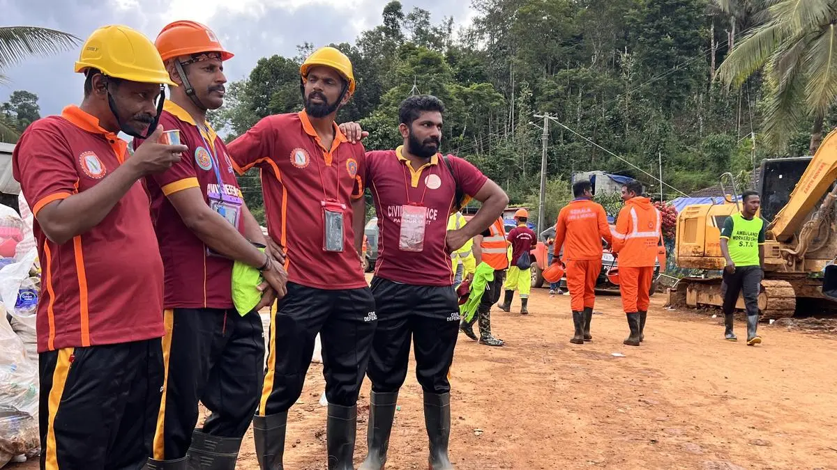 Civil Defence volunteers taking a quick break near the ravaged Chooralmala on August 7, 2024.