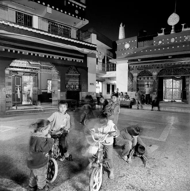 The temple square is also the centre of social life. Here, children playing in the square, a 2009 photograph. The temple square is also the centre of social life. Here, children playing in the square, a 2009 photograph.