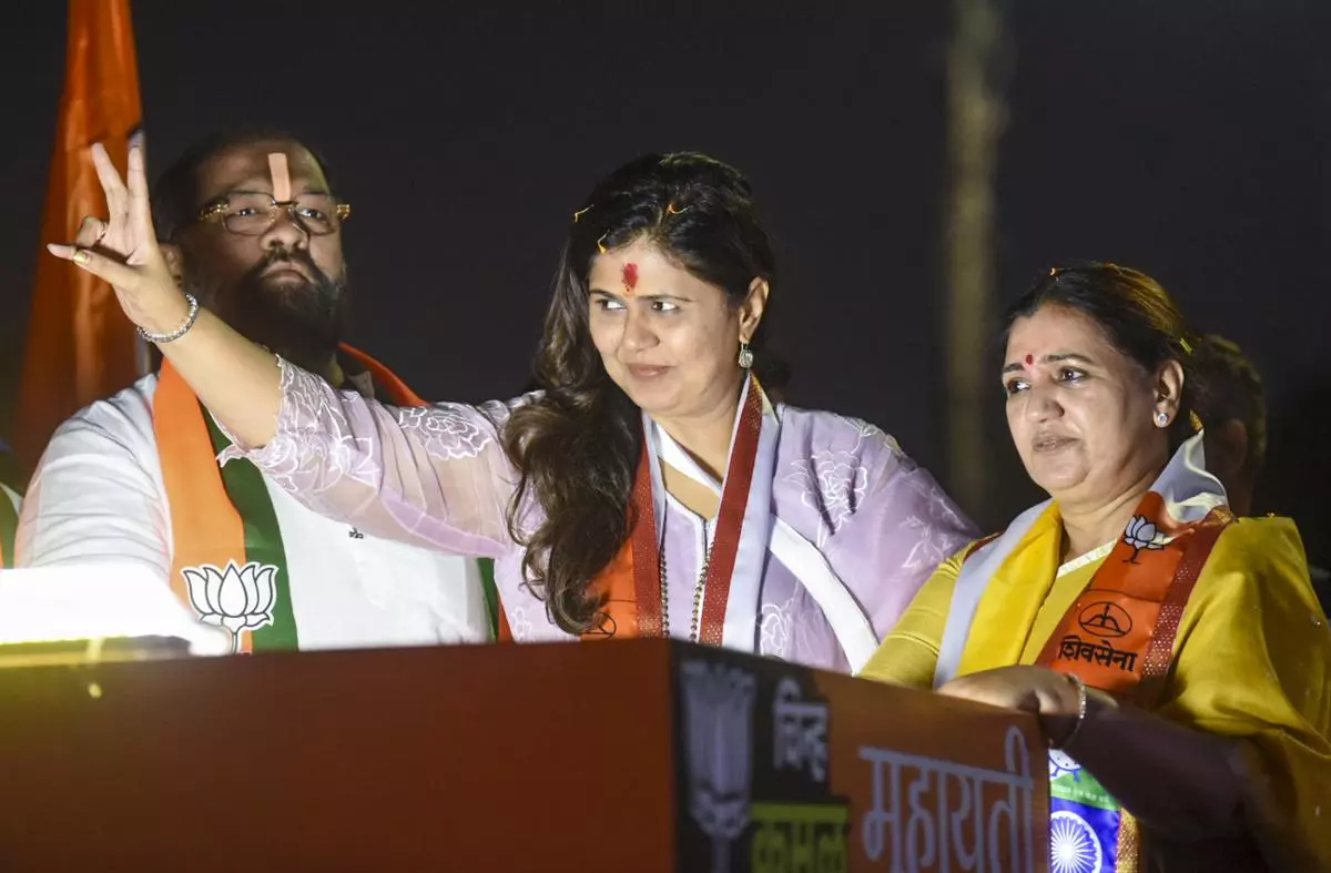 Pankaja Munde (centre) during an election campaign in support of party candidate Madhuri Misal from the Parvati constituency ahead of the Maharashtra Assembly election, on October 5, 2024.