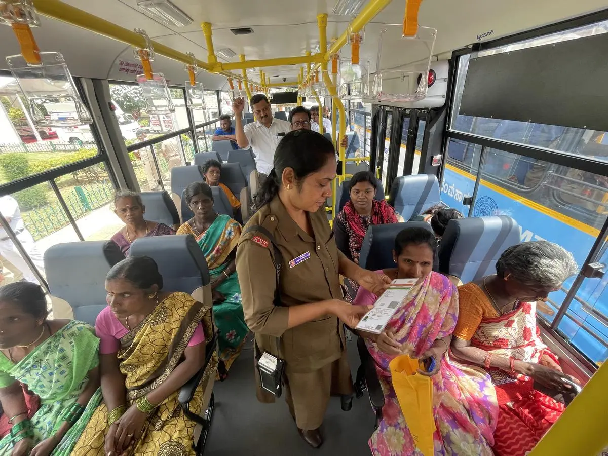 Women travel for free in a State-run bus in Bengaluru under the Shakti scheme, which the Congress government launched in June 2023.