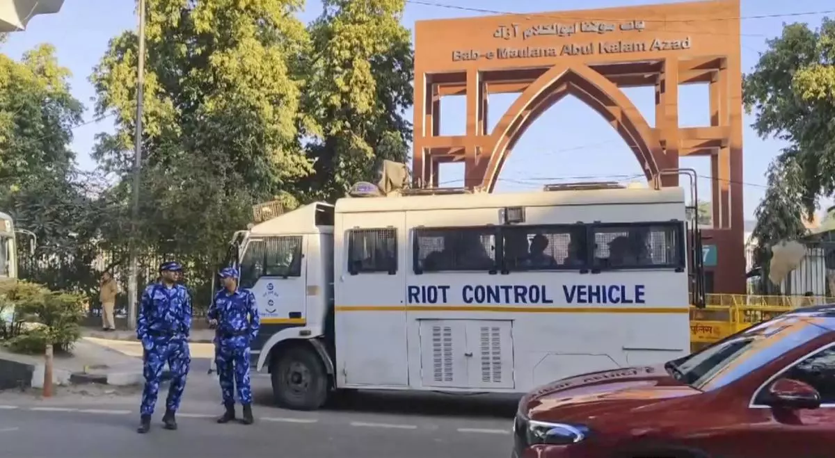 Security personnel deployed outside the Jamia Millia Islamia University in the view of students’ protest, in New Delhi on February 13, 2025.