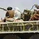 Taliban fighters sit on their military vehicle in Kabul on their way to Baglan province, 200 kilometers (125 miles) north of Kabul.