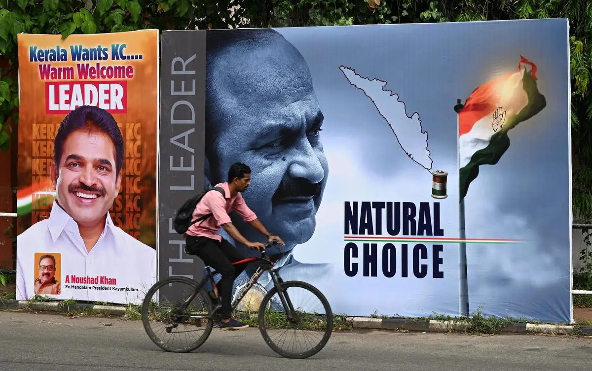 Posters supporting K. C. Venugopal and V. D. Satheesan kept next to each other at Vellayambalam circle amid the Congress race for Kerala Chief Minister, in Thiruvananthapuram, on May 8, 2026.