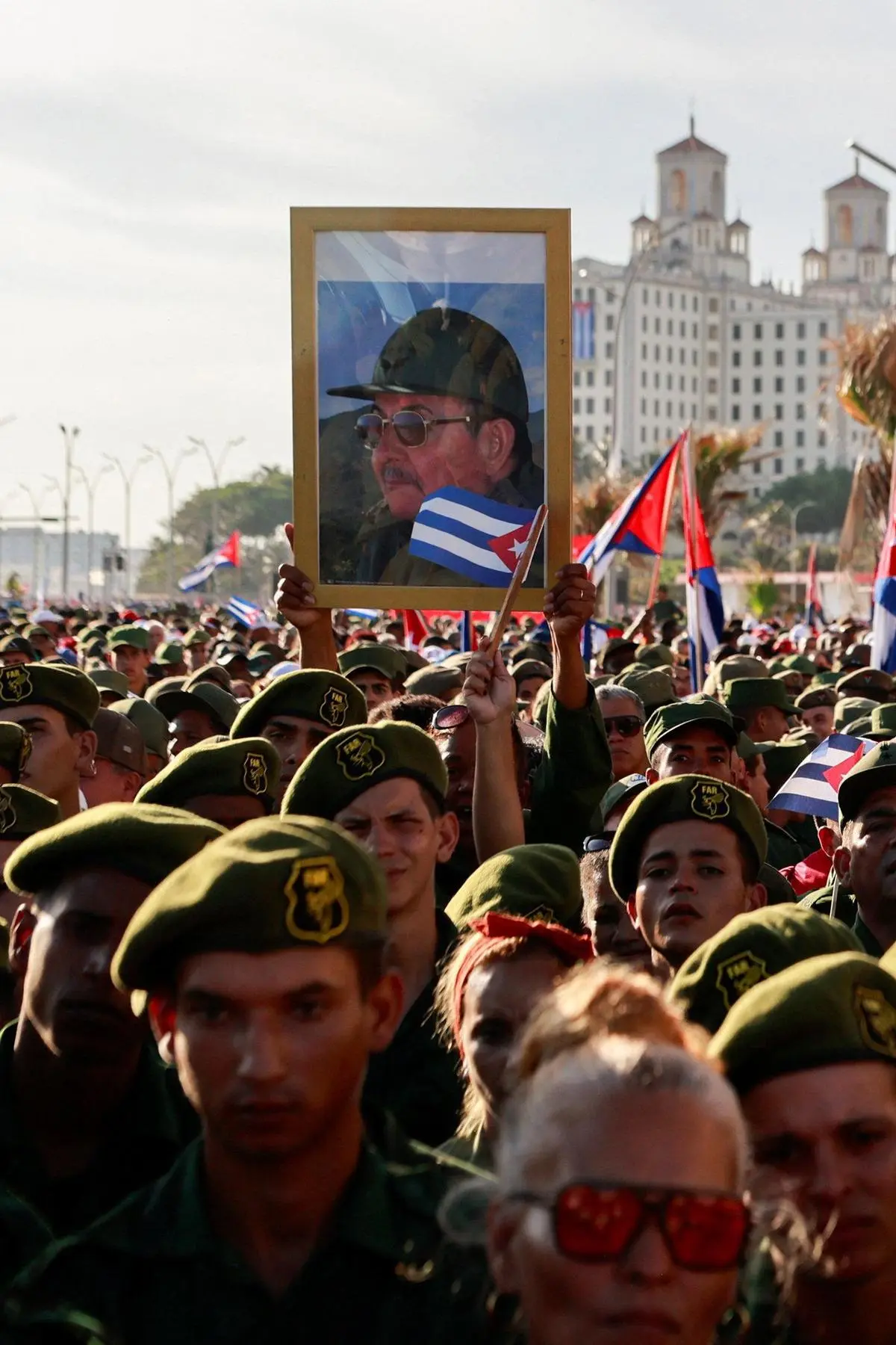 A man holds up a picture of Raúl Castro, former Cuban President indicted by the US, at a rally by the Cuban Revolutionary Armed Forces and others called by Cuban authorities, in Havana, Cuba, on May 22, 2026.
