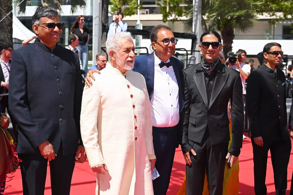 Actors Naseeruddin Shah (centre left) and Prateik Babbar (right, son of Smita Patil) on the red carpet for the screening of Manthan at the Cannes Film Festival on May 17. 