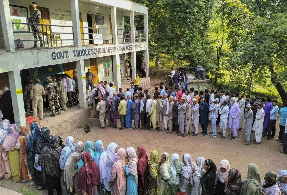 Voters queue up at a polling station in the second phase of the Jammu and Kashmir Assembly election, at Surankote constituency of Poonch district on September 25.